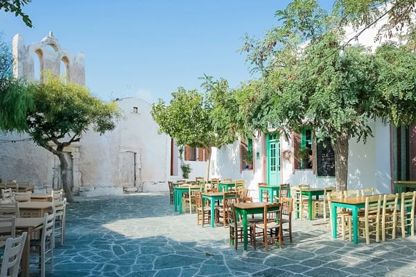 church and square with tables folegandros greece
